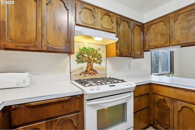 kitchen with white gas range