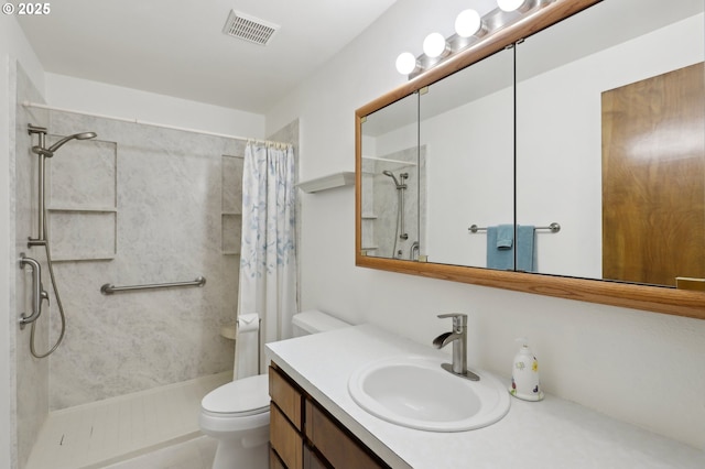 bathroom featuring vanity, curtained shower, and toilet