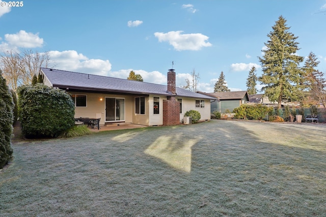 view of front of home with a front lawn and a patio