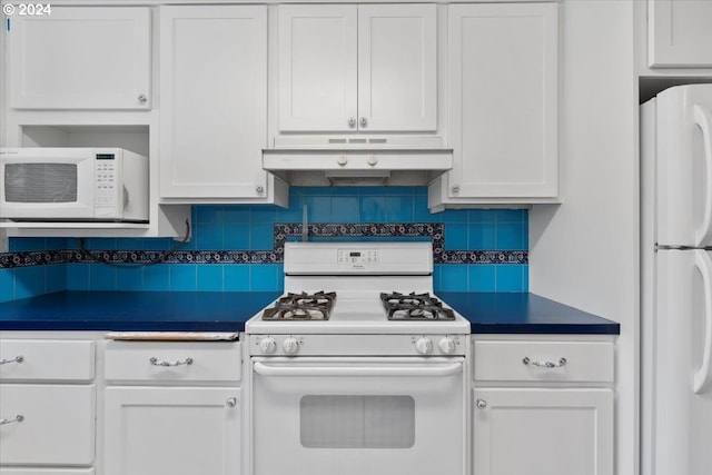 kitchen with backsplash, white appliances, and white cabinets