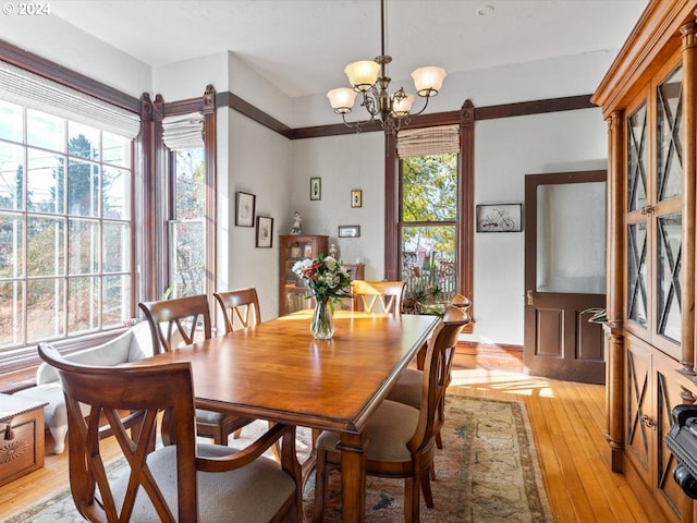 1006 Pine St NE, Silverton, OR 97381 - dining area with light wood-style floors and a chandelier