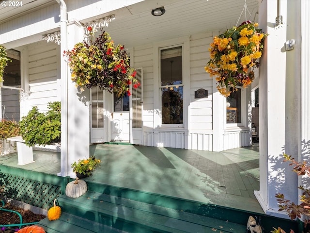 doorway to property featuring covered porch