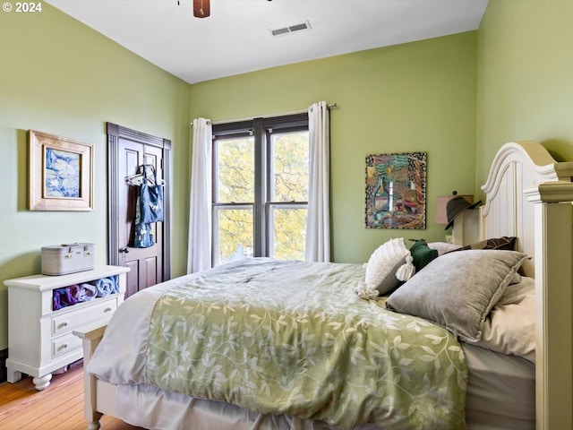 bedroom featuring light hardwood / wood-style floors and ceiling fan