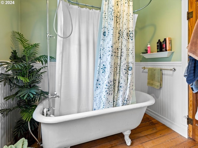 bathroom featuring a tub and wood-type flooring