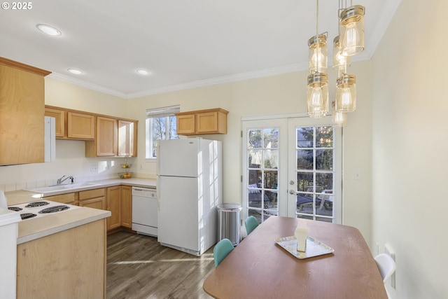 kitchen with light brown cabinetry, french doors, white appliances, sink, and pendant lighting