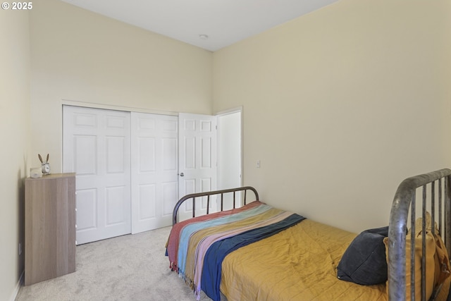 carpeted bedroom featuring a closet