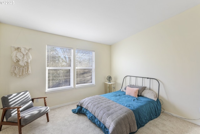 bedroom featuring light colored carpet