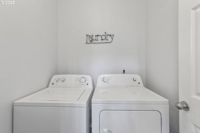 laundry room with washing machine and clothes dryer