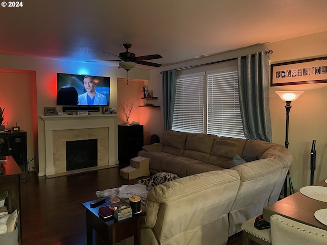 living room with ceiling fan and dark hardwood / wood-style floors