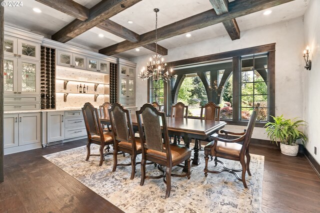 dining space with beam ceiling, a notable chandelier, dark hardwood / wood-style flooring, and coffered ceiling