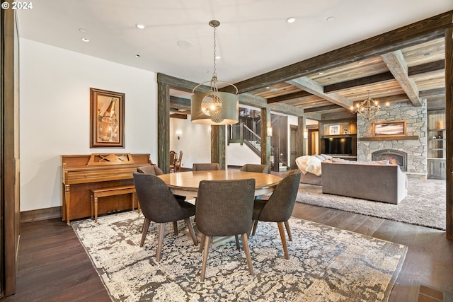 dining room with a fireplace, coffered ceiling, a notable chandelier, beam ceiling, and dark hardwood / wood-style floors