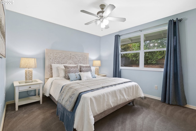 18685 SW Hennig Ct, Beaverton, OR 97003 - bedroom with dark colored carpet, baseboards, and a ceiling fan