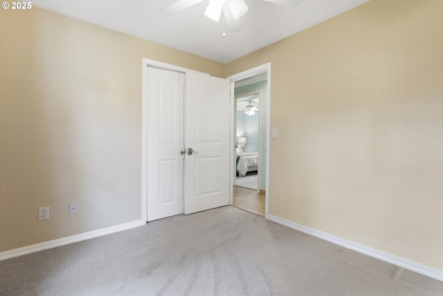18685 SW Hennig Ct, Beaverton, OR 97003 - unfurnished bedroom featuring light carpet, baseboards, a closet, and ceiling fan