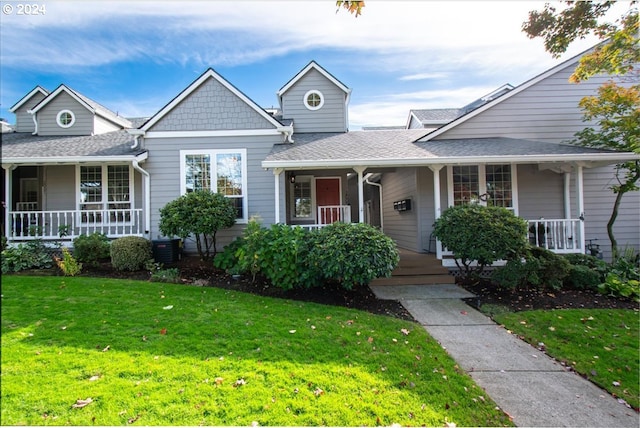 view of front facade featuring a front lawn and covered porch