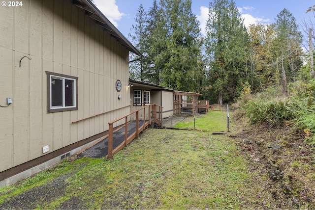 view of yard featuring a wooden deck