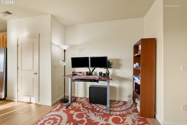 office area with light wood-type flooring