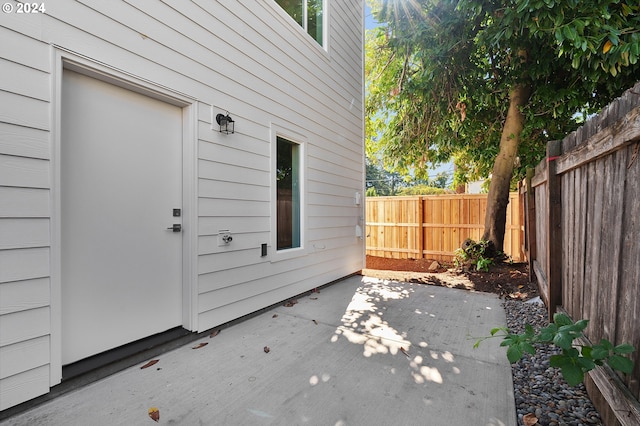 15063 SE Division St, Portland, OR 97236 - view of exterior entry with a patio