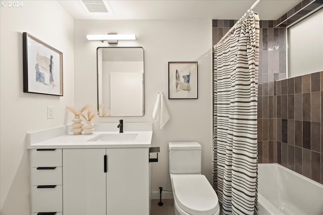 full bathroom featuring vanity, toilet, and shower / bath combo with shower curtain