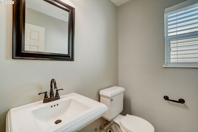 bathroom with toilet and sink