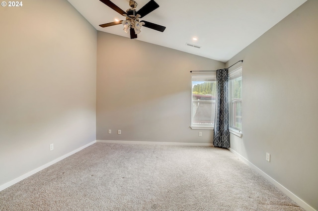 empty room featuring carpet, ceiling fan, and lofted ceiling