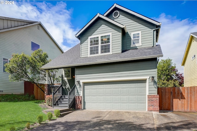 view of front of home featuring a garage and a front lawn