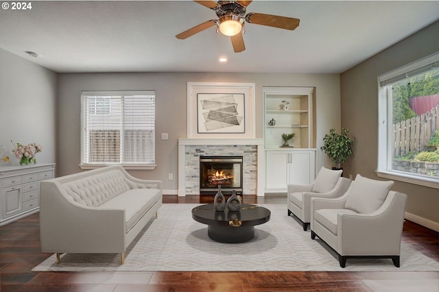 living room with a fireplace, hardwood / wood-style floors, and plenty of natural light