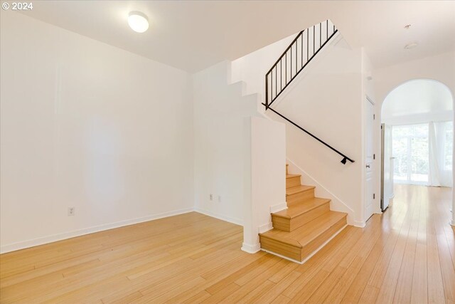 staircase featuring hardwood / wood-style flooring