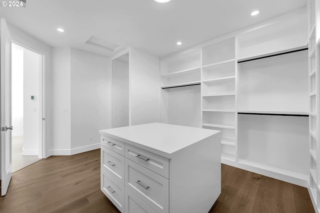 walk in closet featuring dark hardwood / wood-style flooring