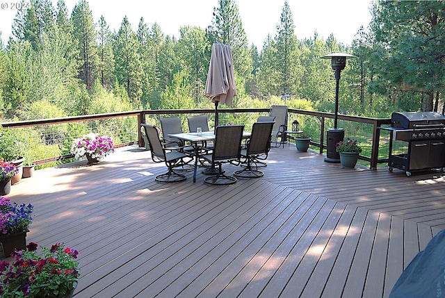 wooden terrace featuring area for grilling