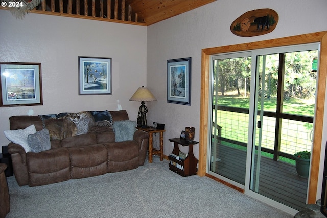 living room with lofted ceiling and carpet floors