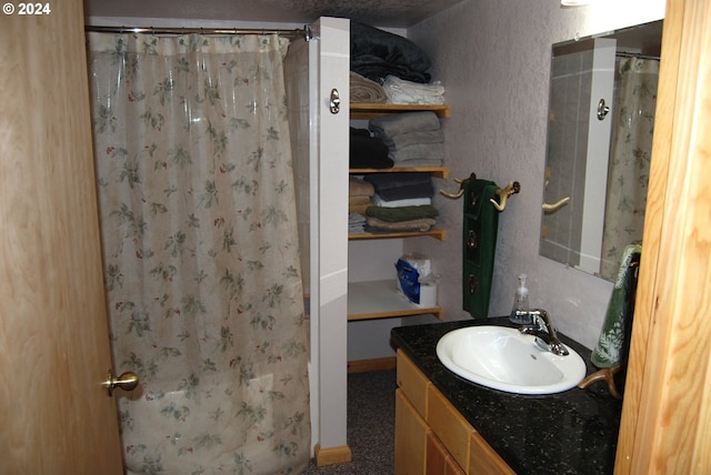 bathroom with vanity and a shower with curtain