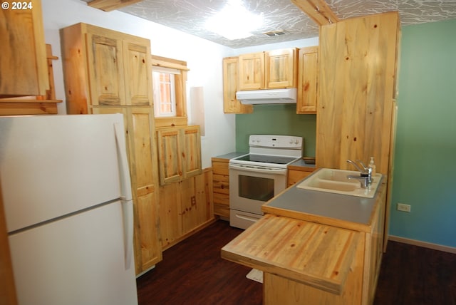 kitchen with dark wood-type flooring, white appliances, light brown cabinetry, and sink