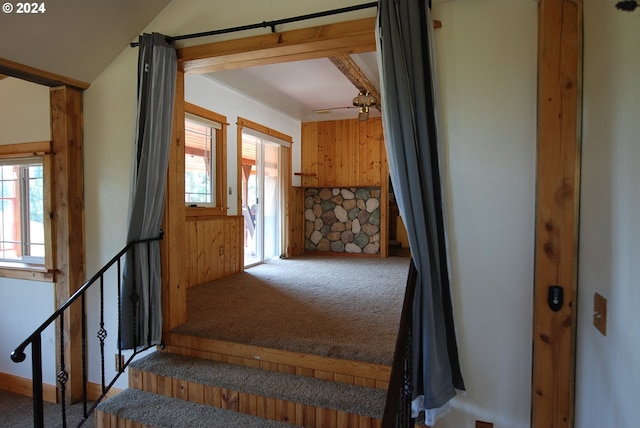 stairway with carpet flooring and ceiling fan