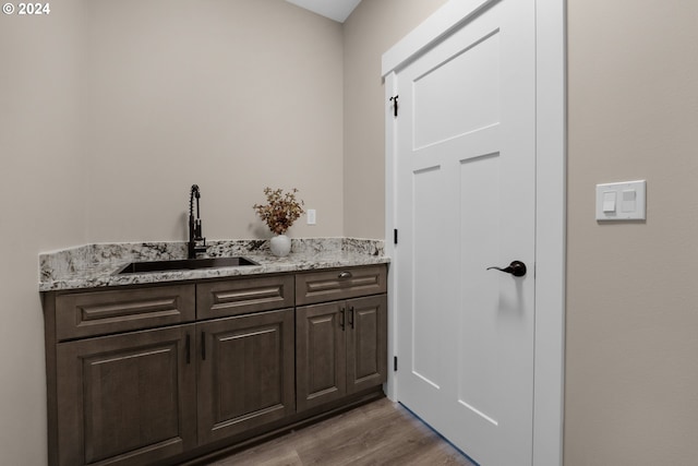 bathroom with vanity and wood-type flooring