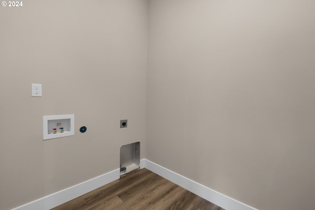 washroom featuring electric dryer hookup, dark hardwood / wood-style floors, and washer hookup