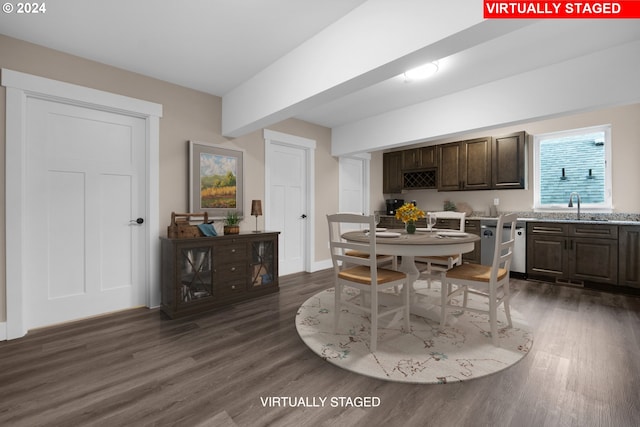 dining space with sink and dark hardwood / wood-style flooring