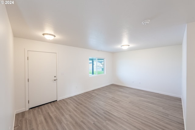 spare room featuring light hardwood / wood-style floors