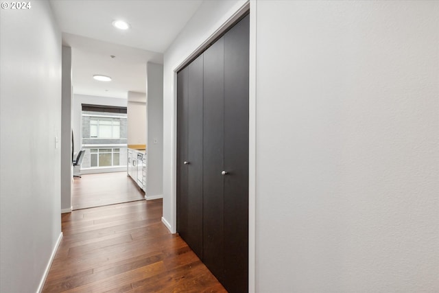 hall with dark hardwood / wood-style floors