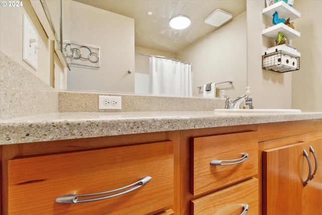 bathroom with decorative backsplash and vanity