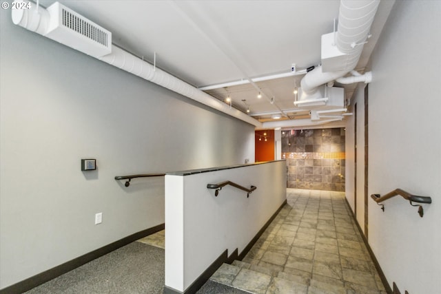 hallway with tile walls