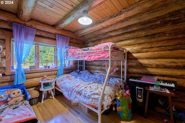 bedroom featuring wooden ceiling, hardwood / wood-style flooring, beam ceiling, and rustic walls