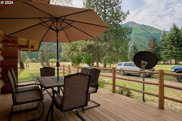 wooden deck featuring a mountain view