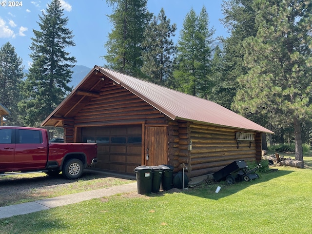 garage with a yard