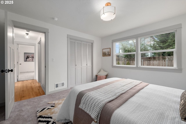 carpeted bedroom with a closet