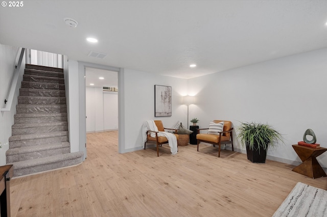 sitting room featuring light hardwood / wood-style flooring