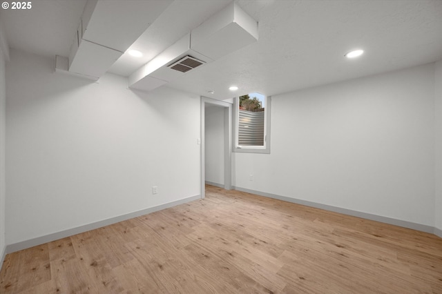 basement with light wood-type flooring