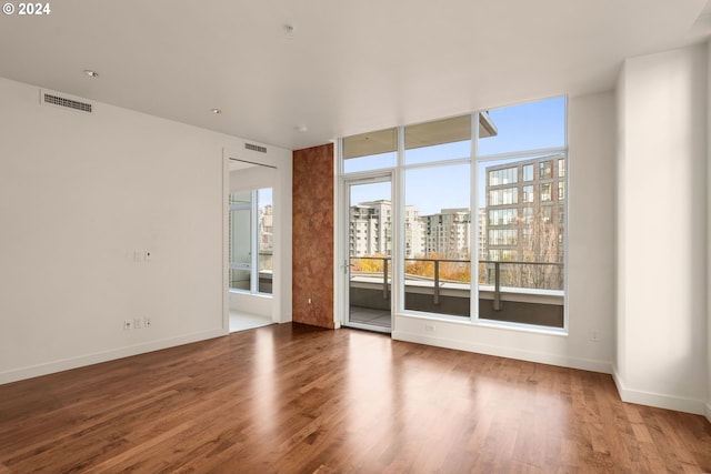 spare room with hardwood / wood-style flooring