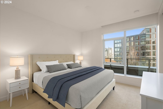 bedroom featuring light colored carpet