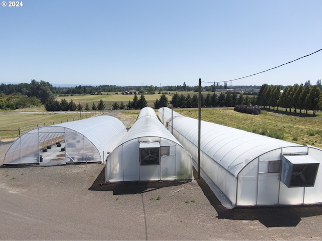 exterior space featuring an outbuilding and a rural view