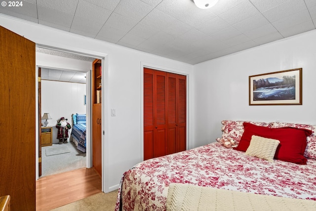 bedroom featuring a closet and carpet floors